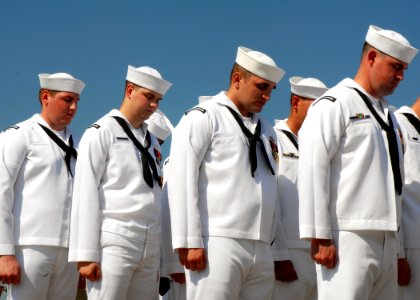 US Navy 080908-N-7668G-110 Crewmembers of the Virginia class attack submarine USS North Carolina (SSN 777) bow their heads in prayer during the North Carolina change of command ceremony at Naval Station Norfolk
