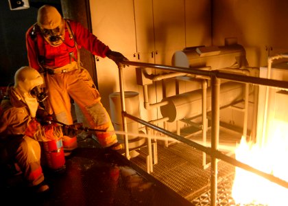 US Navy 080910-N-4649C-001 Sailors assigned to the ballistic-missile submarine USS Henry M. Jackson (SSBN 730) participate in firefighting training at the advanced firefighting school at Trident Training Facility, Bangor