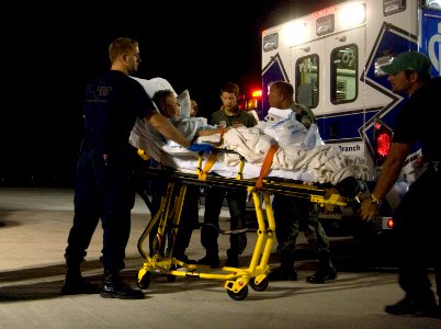 US Navy 080910-N-6266K-026 Air Force personnel assigned to the 6th Medical Group out of McDill Air Force Base, Tampa, Fla. and volunteers from the Disaster Medical Assistance Team (DMAT) assist in the evacuation of patients