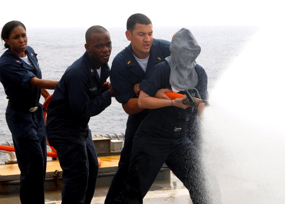 US Navy 080909-N-3392P-080 Sailors participate in a damage control Olympics aboard the amphibious dock landing ship USS Carter Hall (LSD 50)