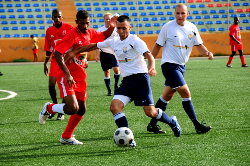 US Navy 080910-N-7526R-102 Yeomen 2nd Class Rafael Flores holds off a defender