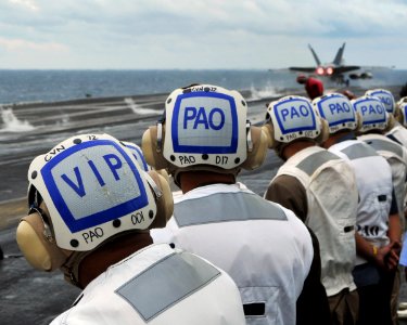 US Navy 080910-N-7981E-118 Senior Cambodian civilian and military officials observe flight operations aboard the aircraft carrier USS Abraham Lincoln (CVN 72) photo