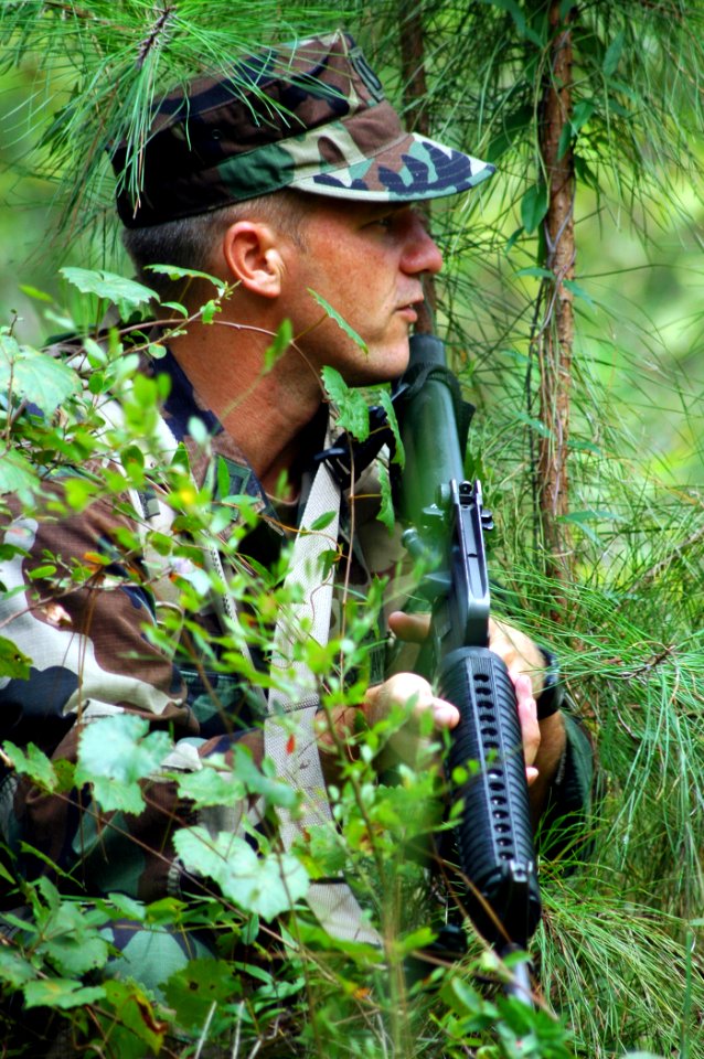 US Navy 080911-N-7367K-001 Lt. Adam Perrins keeps watch on a road