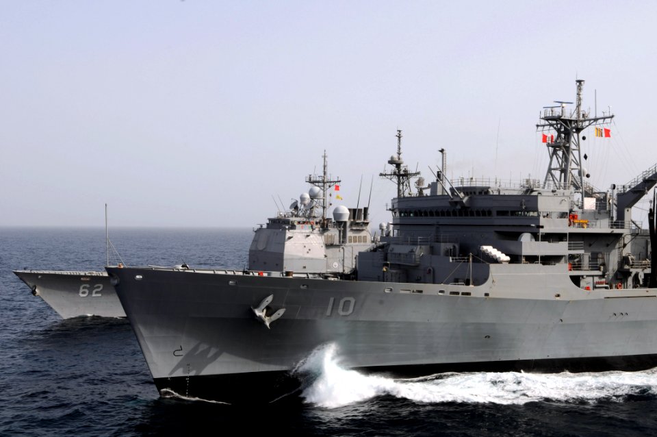 US Navy 080911-N-3659B-165 The guided-missile cruiser USS Chancellorsville (CG 62) steams through the North Arabian Sea alongside the USNS Bridge (T-AOE 10) during a replenishment at sea