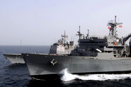 US Navy 080911-N-3659B-165 The guided-missile cruiser USS Chancellorsville (CG 62) steams through the North Arabian Sea alongside the USNS Bridge (T-AOE 10) during a replenishment at sea