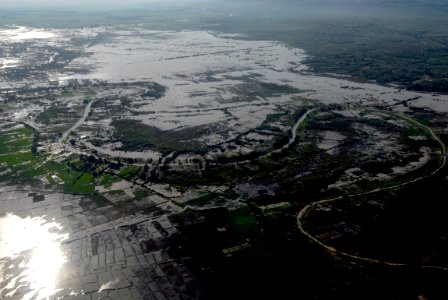 US Navy 080914-N-3595W-030 A levy that separates Port-au-Prince and Les Cais is broken due to Hurricane Ike photo