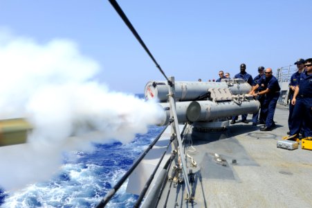 US Navy 110730-N-ZZ999-006 Sailors aboard USS Nitze (DDG 94) perform a recoverable exercise torpedo (REXTORP) fire exercise photo
