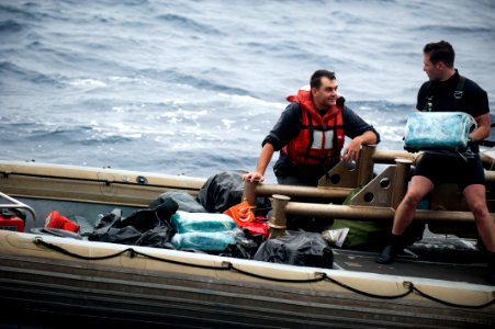 US Navy 110820-N-PB383-247 Sailors respond to a vessel in distress and recover suspected drugs