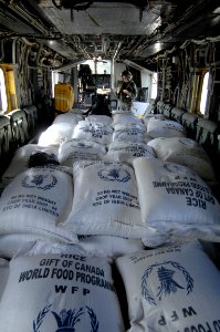 US Navy 080914-N-9620B-109 Relief supplies are stacked in a Navy helicopter assigned to the amphibious assault ship USS Kearsarge (LHD 3) for distribution in areas affected by recent hurricanes in Haiti photo