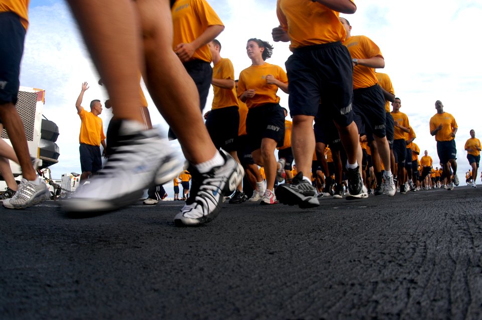 US Navy 080910-N-8154G-110 Sailors aboard the multi-purpose amphibious assault ship USS Bataan (LHD 5) participate in command-wide physical training on the ship's flight deck