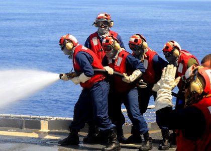 US Navy 080911-N-1082Z-037 Sailors from the flight deck firefighting team practice firefighting techniques