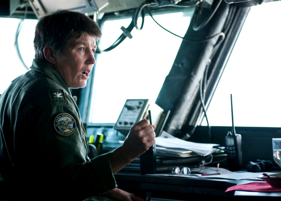US Navy 110825-N-PM781-003 Capt. Brenda Holdener, commanding officer of the amphibious assault ship USS Wasp (LHD 1), gives direction to her bridge