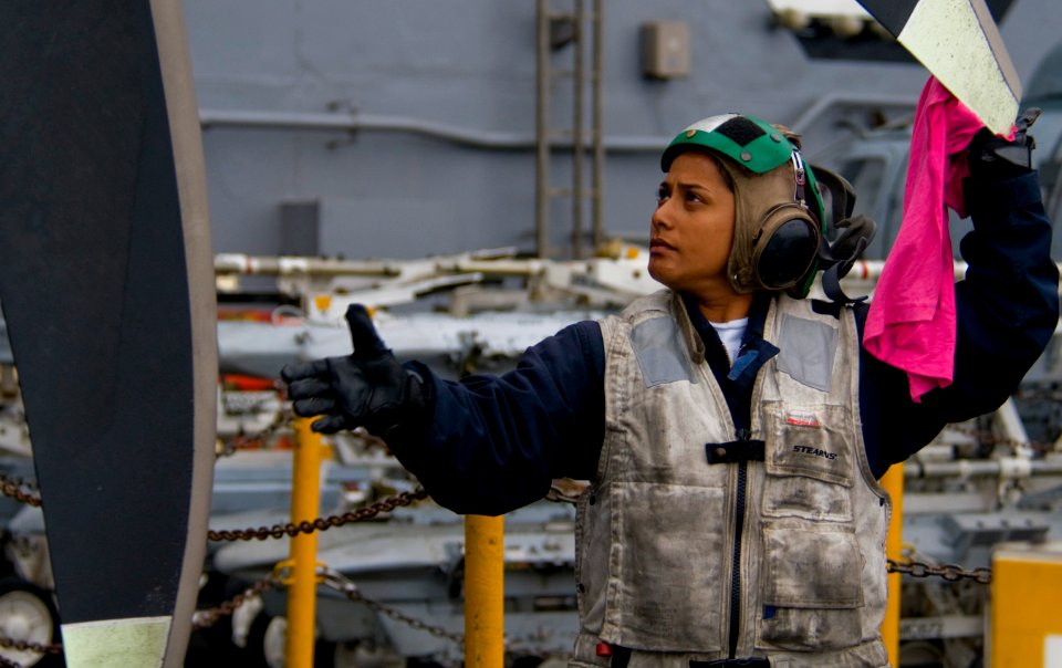US Navy 110921-N-OK922-079 Aviation Machinist's Mate 2nd Class Farzana Lively, assigned to Carrier Airborne Early Warning Squadron (VAW) 125