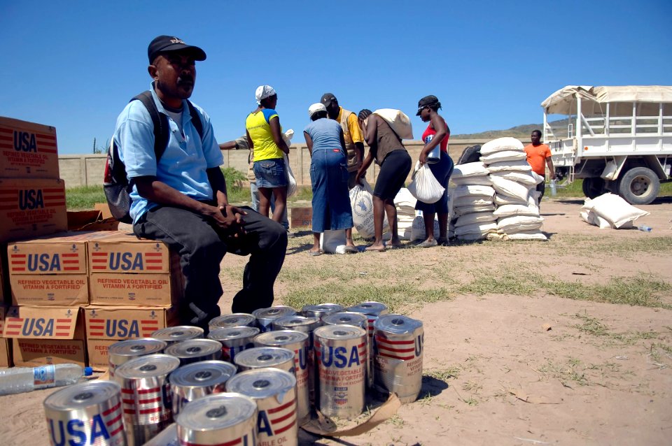 US Navy 080915-N-1508S-107 Haitian families receive food and fresh water from U.N. officials during relief efforts in areas of Haiti devastated by recent hurricanes