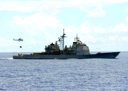 US Navy 080917-N-1038M-033 The Ticonderoga-class guided-missile cruiser USS Cowpens (CG 63) conducts a vertical replenishment photo