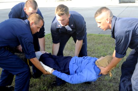 US Navy 080912-N-5307M-065 Sailors assigned to the guided-missile frigate USS Doyle (FFG 39) demonstrate proper procedures for moving casualties onto a stretcher