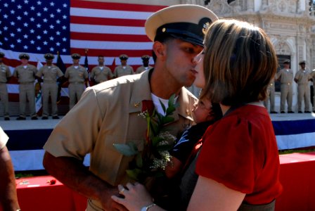 US Navy 080916-N-9818V-450 Chief Boatswain's Mate Noel Aliceacintron kisses his wife after she pinned on his chief anchors photo