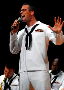 US Navy 080917-N-2013O-001 Musician 2nd Class Alex Ivy sings a solo during a 7th Fleet Band performance