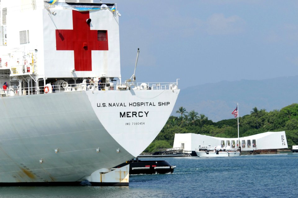 US Navy 080915-N-9758L-270 The Military Sealift Command hospital ship USNS Mercy (T-AH 19) passes the USS Arizona Memorial as she makes her way into Naval Station Pearl Harbor