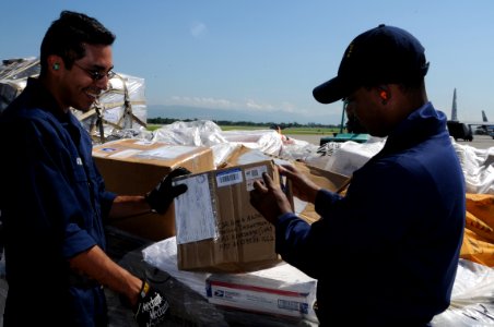 US Navy 080917-N-5642P-074 Postal Clerk 1st Class Preston Johnson and Postal Clerk Seaman Gabriel Garza inventory mail