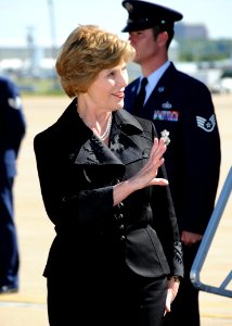 US Navy 080916-N-8053S-112 First Lady Laura Bush waves at the crowd gathered at Naval Air Station Joint Reserve Base Fort Worth, Texas