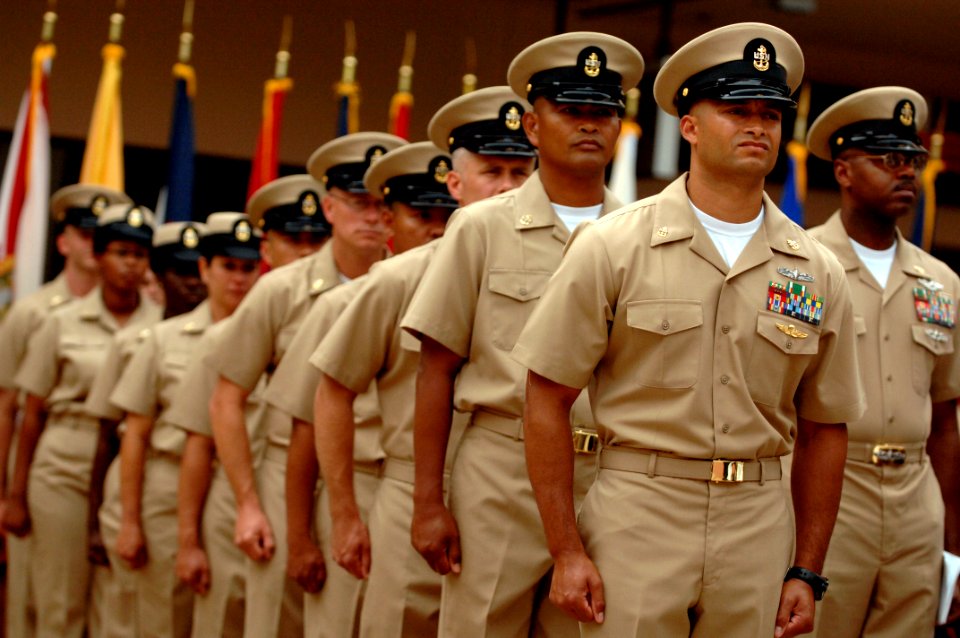 US Navy 080916-N-9818V-181 Newly pinned chief petty officer stand in formation after receiving their anchors and donning of their hat