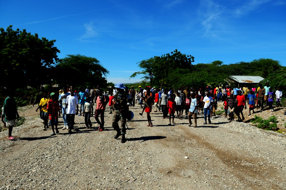 US Navy 080917-N-4515N-061 Villagers follow behind medical personnel from the amphibious assault ship USS Kearsarge (LHD 3) photo