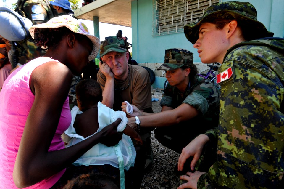 US Navy 080918-N-8907D-005 Medical personnel currently embarked aboard the amphibious assault ship USS Kearsarge (LHD 3) examine residents of Trois Ponts during a health assessment survey to determine future relief operations