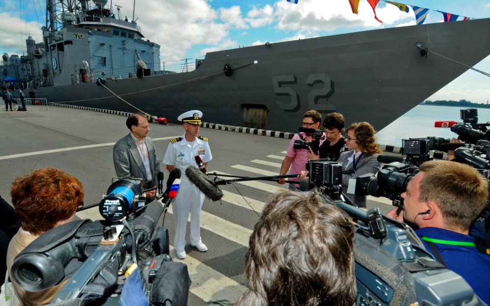 US Navy 110628-N-OM642-399 Cmdr. Patrick E. Kulakowski, commanding officer of the guided-missile frigate USS Carr (FFG 52), speaks with Russian med
