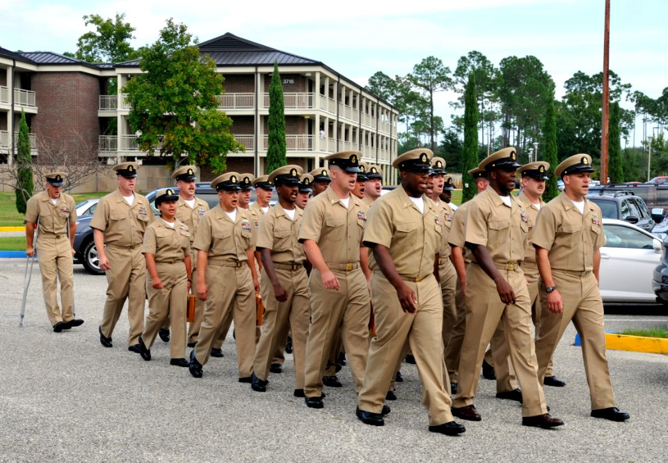 US Navy 080916-N-5328N-604 Newly-minted chief petty officers march to their new home at the Chief Petty Officers Mess from the chapel at Corry Station