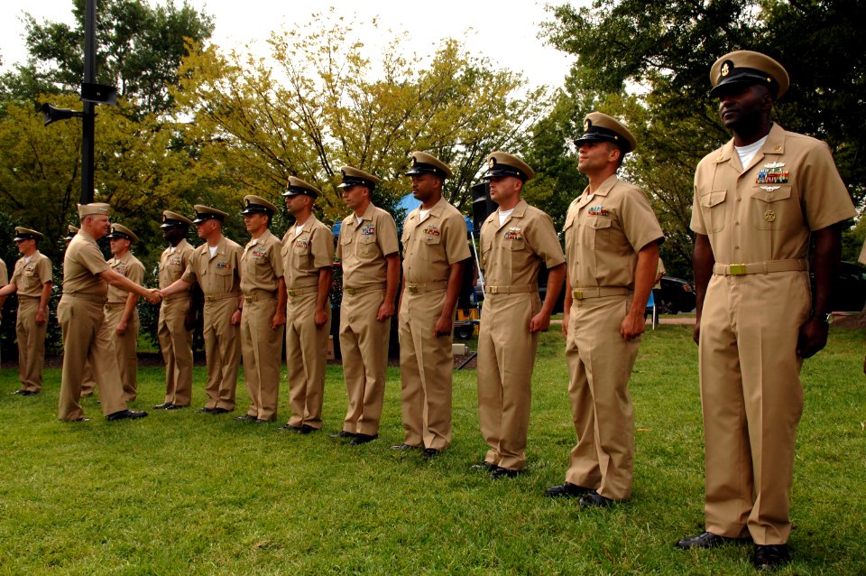 US Navy 080916-N-8273J-167 Chief of Naval Operations (CNO) Adm. Gary Roughead congratulates 68 new chief petty officers during a pinning ceremony at Admiral Leutze Park at the Washington Navy Yard