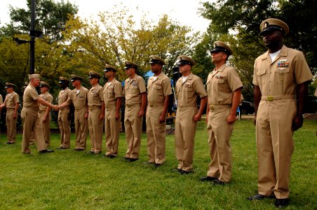 US Navy 080916-N-8273J-167 Chief of Naval Operations (CNO) Adm. Gary Roughead congratulates 68 new chief petty officers during a pinning ceremony at Admiral Leutze Park at the Washington Navy Yard