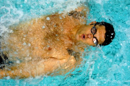 US Navy 110520-N-CD297-084 Explosive Ordnance Disposal 1st Class Patrick Woodruff swims in the 50-meter Backstroke event as a member of Team Navy-C