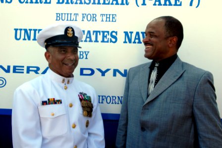 US Navy 080918-N-9818V-412 Master Chief Petty Officer of the Navy (MCPON) Joe R. Campa Jr. speaks with Phillip Brashear, son of Master Chief Carl Brashear, following the christening ceremony for USNS Carl Brashear (T-AKE 7) hel