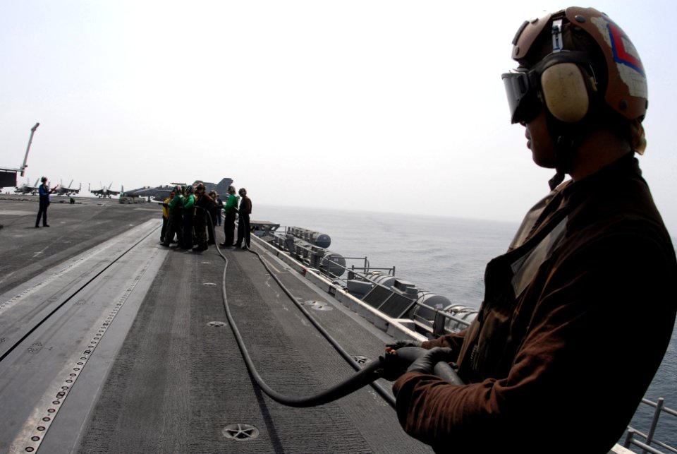 US Navy 080919-N-4995K-149 Sailors simulate firefighting during flight deck drills aboard the Nimitz-class aircraft carrier USS Ronald Reagan (CVN 76) photo