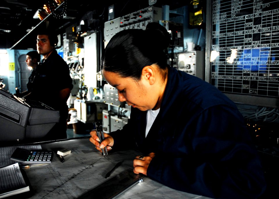US Navy 080922-N-2183K-034 Quartermaster Seaman Melissa Ruizmontijo checks time, speed and distance for accurate dead reckoning on the bridge of the amphibious assault ship USS Peleliu (LHA 5)