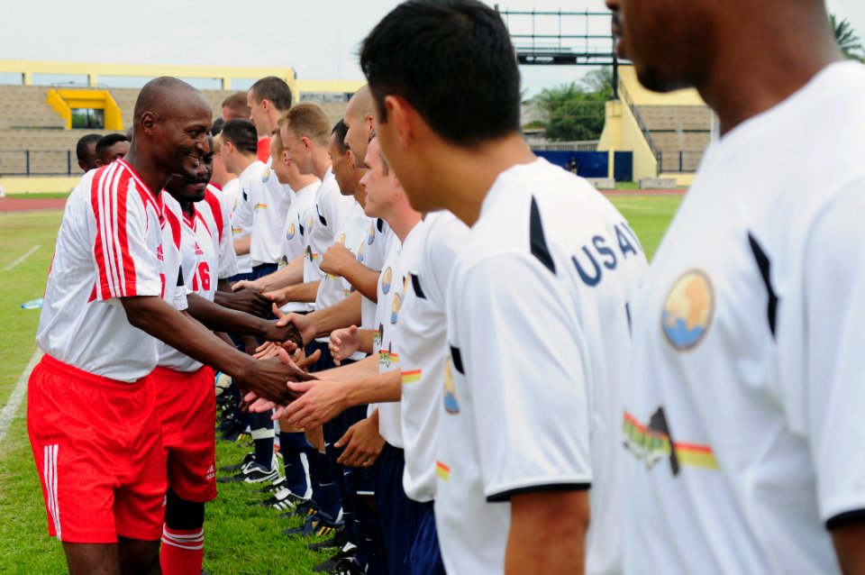 US Navy 080917-N-7526R-046 he Gabonese Division 1 soccer team FC Missile shakes hands with members of the Commander, Navy Region Europe soccer team before a match at Gabon national stadium in Libreville, Gabon