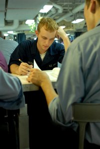US Navy 080919-N-7730P-029 Air Traffic Controller Airman Robert Hoth concentrates on his exam during the Navy-wide E-4 advancement exam aboard the Nimitz-class aircraft carrier USS Ronald Reagan (CVN 76)