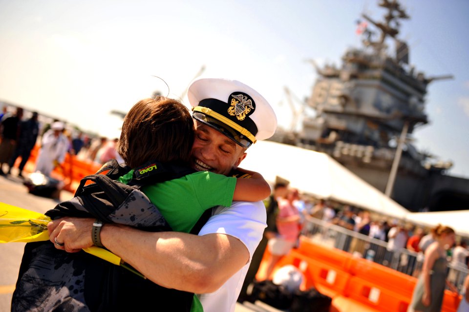 US Navy 110713-N-YR391-178 Lt. Lief Walroth greets his son during a homecoming celebration