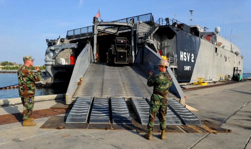 US Navy 110405-N-WX845-014 Sailors offload their equipment from High Speed Vessel Swift (HSV 2) following a five-month deployment