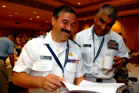US Navy 080922-N-9818V-018 Master Chief Petty Officer of the Navy (MCPON) Joe R. Campa Jr. speaks with Marcos Corral-Zambrana of the Chilean Navy