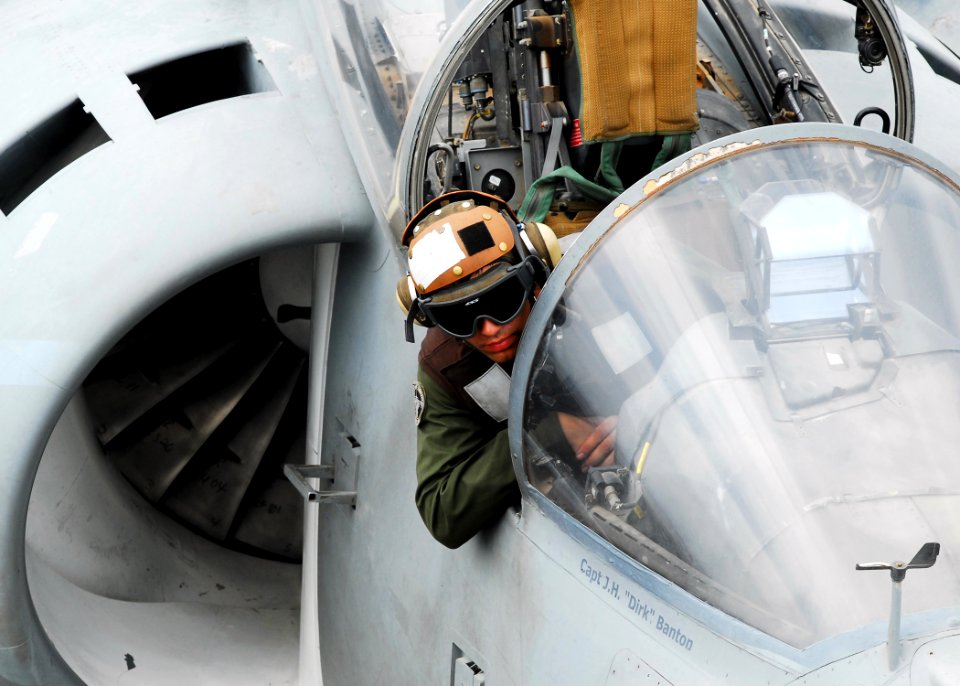 US Navy 080922-N-2183K-097 A plane captain of an AV-8B Harrier jet guides the aircraft as it is towed on the flight deck