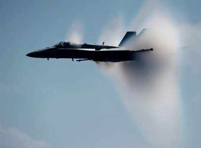 US Navy 110603-N-DR144-177 An F-A-18C Hornet breaks the sound barrier alongside USS Carl Vinson (CVN 70) during an air power demonstration