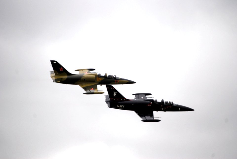 US Navy 080921-N-4469F-004 Two L-39 Albatross aircraft painted in opposing color schemes fly in formation during the 50th Anniversary Naval Air Station Oceana Air Show
