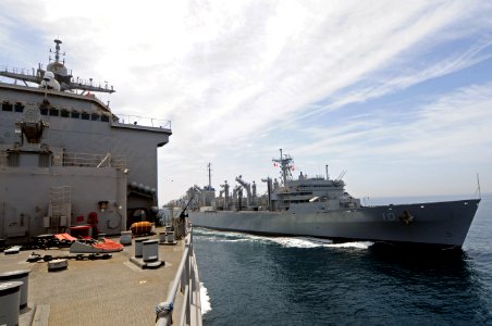 US Navy 110517-N-RC734-167 USNS Bridge (T-AOE 10), right, transits alongside USS Comstock (LSD 45) during an underway replenishment