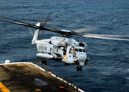 US Navy 080922-N-2183K-019 A CH-53E Super Stallion helicopter lifts off from the flight deck of the amphibious assault ship USS Peleliu (LHA 5) photo