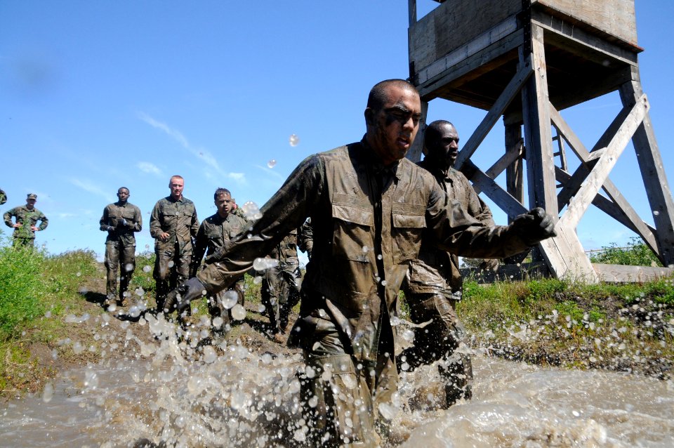 US Navy 110325-N-SI773-905 Sailors participate in a four-pit run obstacle during the 2nd annual Vietnam-6 Memorial Super Squad competition