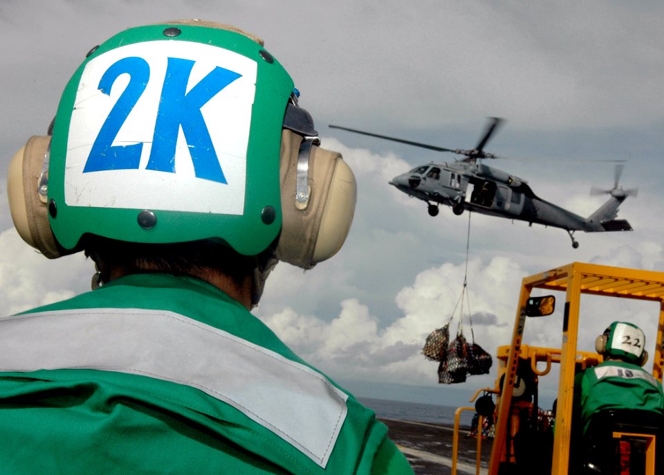 US Navy 080922-N-6736G-165 Seaman Timothy Standish, from Dekalo County, Ga., observes a vertical replenishment aboard the aircraft carrier USS Abraham Lincoln (CVN 72)