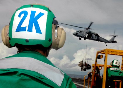 US Navy 080922-N-6736G-165 Seaman Timothy Standish, from Dekalo County, Ga., observes a vertical replenishment aboard the aircraft carrier USS Abraham Lincoln (CVN 72)