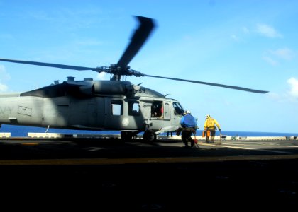 US Navy 080923-N-5148B-017 An MH-60S Sea Hawk lands on the flight deck of the amphibious assault ship USS Peleliu (LHA 5)
